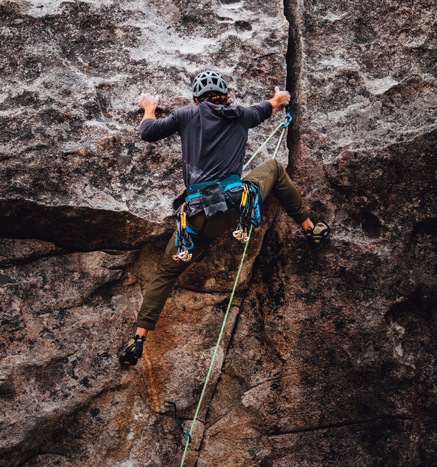 A climber scaling a mountain; clever word-play.